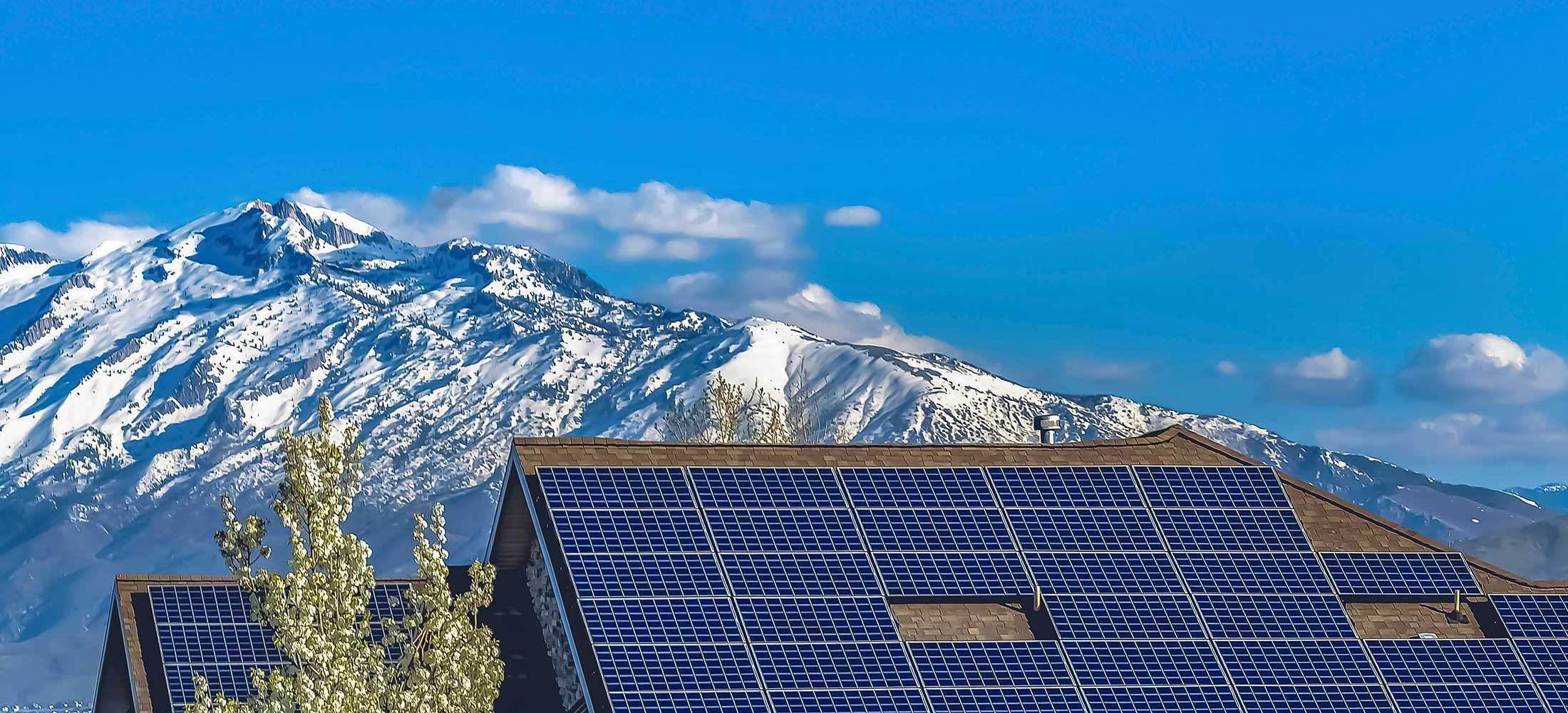 Mountain home with solar panels on the roof
